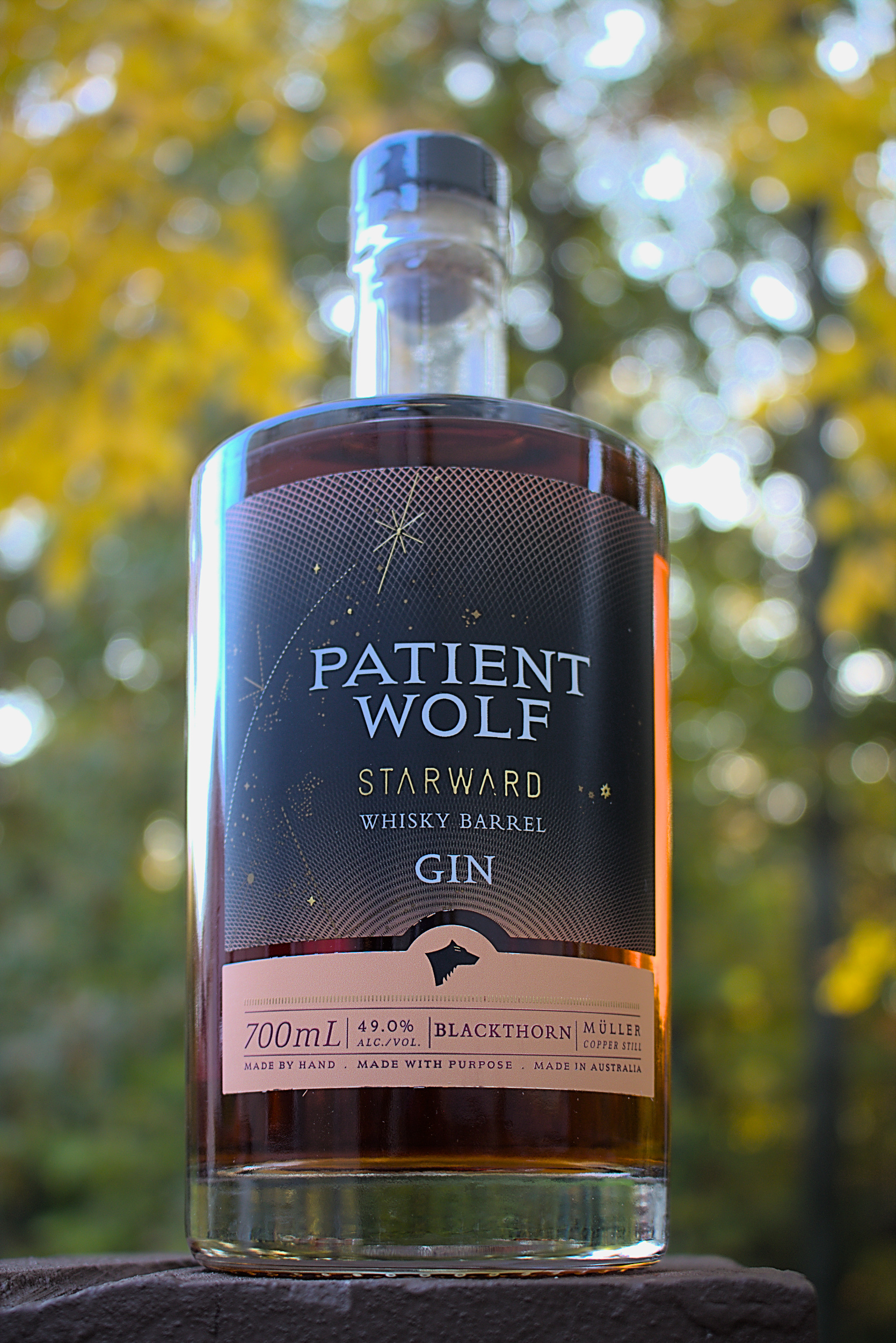 https://www.firstpourcocktails.com/wp-content/uploads/2023/08/Patient-Wolf-Starward-Whisky-Barrel-Gin-Bottle.jpg